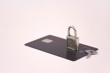 Financial fraud protection concept: credit card, padlock and master key.