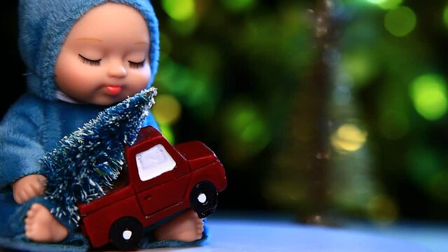 footage of doll new year toy truck gold fir tree dark background 