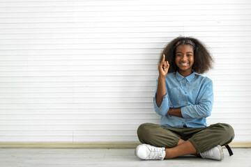 Portrait happy black african american cute girl smiling face looking at camara and think at home, kid, child, young adorable, student, elementary school and education concept
