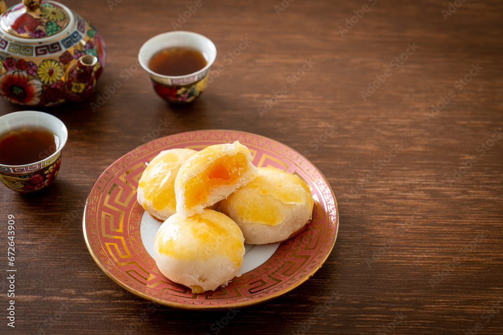 Poster chinese pastry moon cake with salted egg peanut or spring roll pastry with nuts and salted eggs