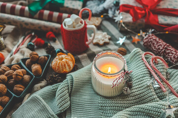 Candle and New Year's gifts, Christmas mood