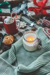 Candle and New Year's gifts, Christmas mood