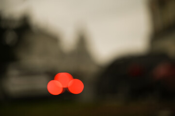 evening city street in the light of headlights and lanterns blur background