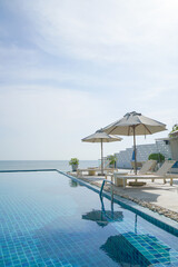 bed pool around swimming pool with sea background