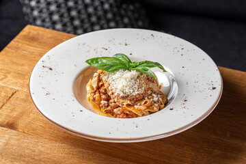 spaghetti bolognese with ragout sauce and parmesan cheese