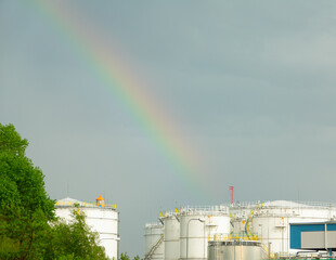 Rainbow over oil tanks