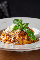 spaghetti bolognese with ragout sauce and parmesan cheese