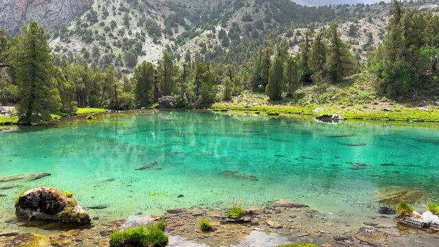 The Alaudin (Chapdara) lakes, lying at an altitude of 2800 m, are considered one of the most beautiful lakes of the Fan Mountains. Turquoise mountain lake. Pamiro-Alai. Tajikistan, Pamir 4K