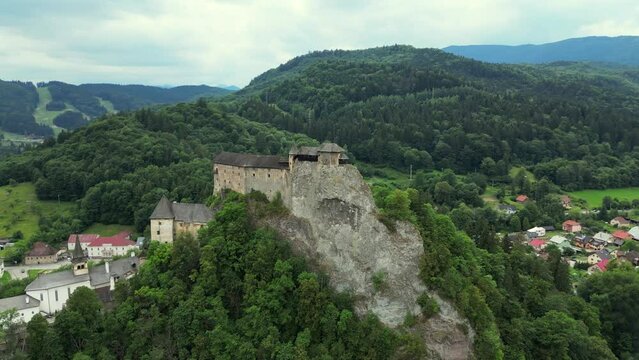 Orava castle - Oravsky Hrad in Oravsky Podzamok in Slovakia. Medieval Oravsky Hrad castle on high and steep cliffs by the Orava River. Beautiful summer day.