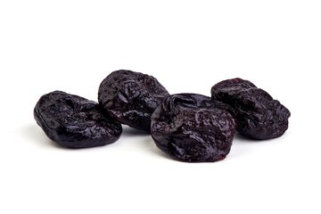 Prunes, dried fruits, close-up, isolated on white background.
