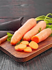 Carrots fresh on wooden board