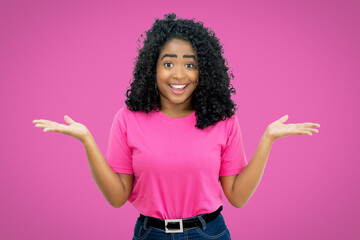 Pretty mexican young adult woman on pink background