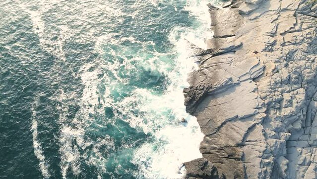 waves crashing on rocks