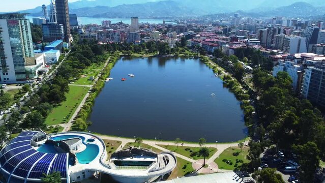 Aerial video of May 6 Park in Batumi, highlighting the lake and surrounding city attractions from above.