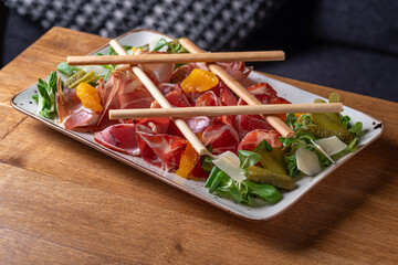 Wine set prosciutto, ventricina, bresaola and grissini bread sticks. Traditional Italian antipasti.