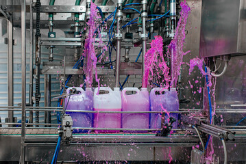 Filling bottles with water, Bottling factorys, plastic canisters, Empty plastic jerrycans moving on...