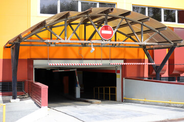 Entrance Gate to underground garage parking. Automatic barrier in underground car parking.