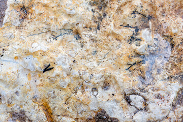 Colours, textures and patterns on a natural stone. Stone background.