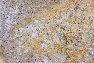 Colours, textures and patterns on a natural stone. Stone background.