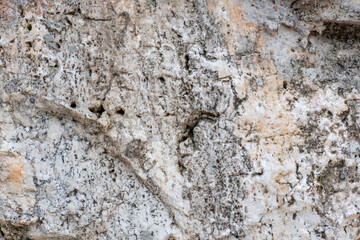 Colours, textures and patterns on a natural stone. Stone background.