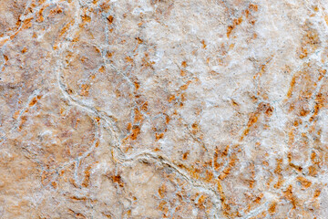 Colours, textures and patterns on a natural stone. Stone background.