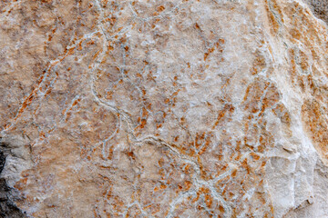 Colours, textures and patterns on a natural stone. Stone background.