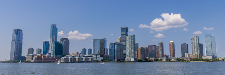 Naklejka premium Skyline view of Jersey City as seen from a boat on the Hudson river, New Jersey, USA