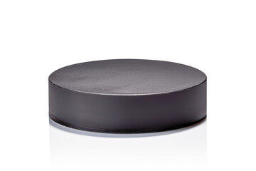 a black hockey puck isolated on white background, highlighting the essential equipment used in the competitive sport
