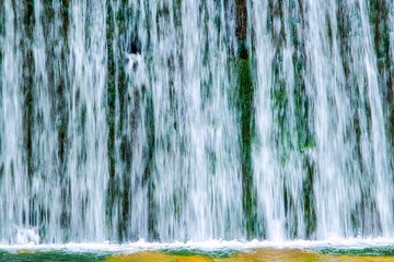 A beautiful view of the falling water cascade, Ciucaș Mountains, Romania