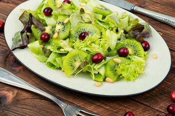 Healthy diet, salad of kiwi and herbs.