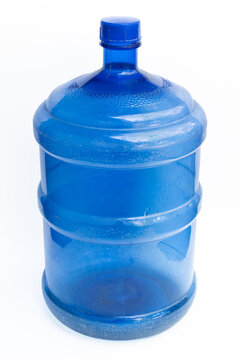 Hard plastic bucket with blue lid A large tank for holding water for use in daily household activities. Blue plastic bucket on white background.