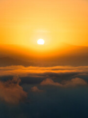 Sunrise over clouds