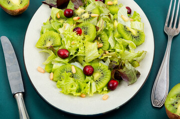 Healthy salad of kiwi and herbs.