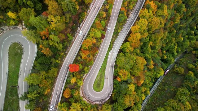 Rising view over Mendel Pass road with mendel train in fall