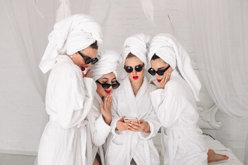 Well-groomed girls get together to celebrate a bachelorette party. Women after spa treatments,...