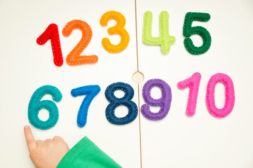 Hand made stuffed felt numbers from 1 to 10 in different colors. Safe eco stuffed toy for infants and toddlers. Early education. Learning colors and to count from zero to ten. Early education.