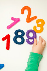 Hand made stuffed felt numbers from 1 to 10 in different colors. Safe eco stuffed toy for infants and toddlers. Early education. Learning colors and to count from zero to ten. Early education.