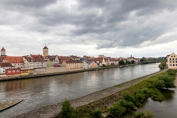 The Danube River and Old Town, the UNESCO World Heritage Site, as viewed from the Old Stone Brigde (German: Steinerne Brücke), Regensburg, Germany