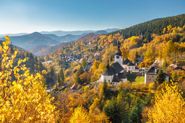 The Spania Dolina village with church and historic buildings in valley of autumn landscape, Slovakia, Europe. - obrazy, fototapety, plakaty