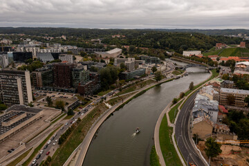 Fototapeta na wymiar Drone photography of river and cityscape with parks and buildings