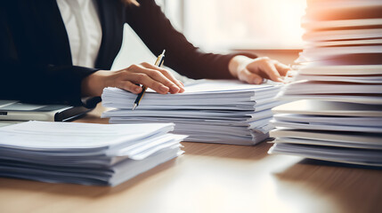 Businesswoman hands working in Stacks of paper files for searching information on work desk in office, business report papers, work hard