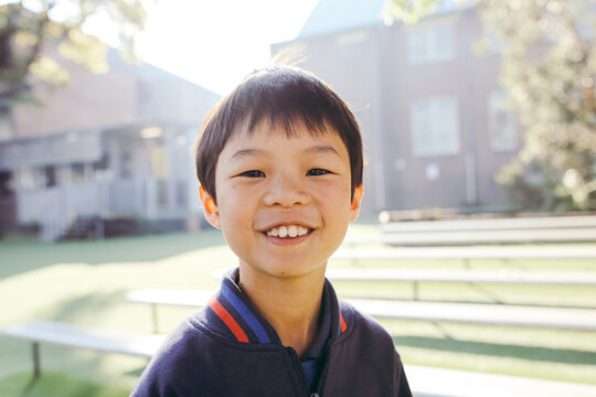 Portrait of primary school boy in the playground at school