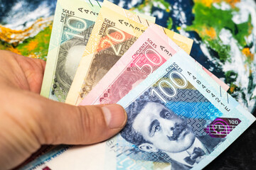 Peru money, exchange rates, world economy, financial business concept, Peruvian sol held in hand on...