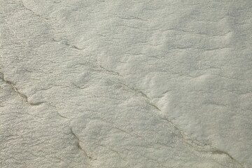 Closeup of snow forming abstract patterns in winter.