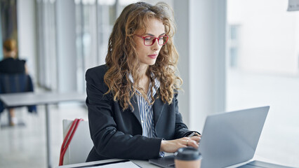 Young woman business worker using laptop working at the office