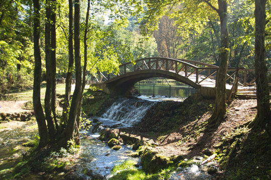 A wood bridge on the spring of Bosna river in Vrelo Bosne park in Bosnia and Herzegovina