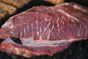 Sizzling steaks grilling on a hot barbecue, ready to be cooked to perfection