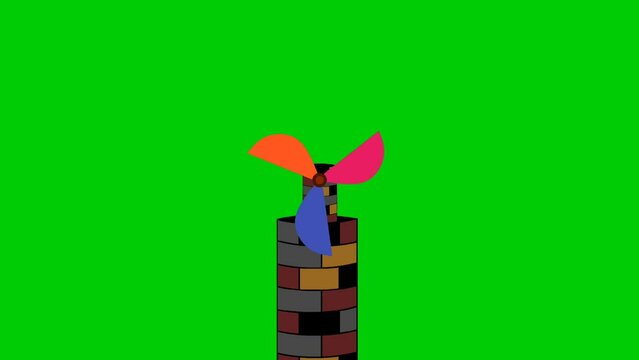 Cartoon animation of a windmill with colorful propellers on top of an old tower, green background