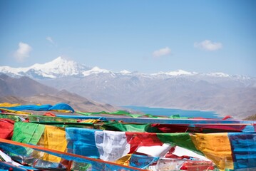 Close up of Tibetan prayer flags with the Himalayan mountains in the background