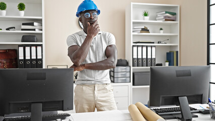 African american man architect standing thinking at the office